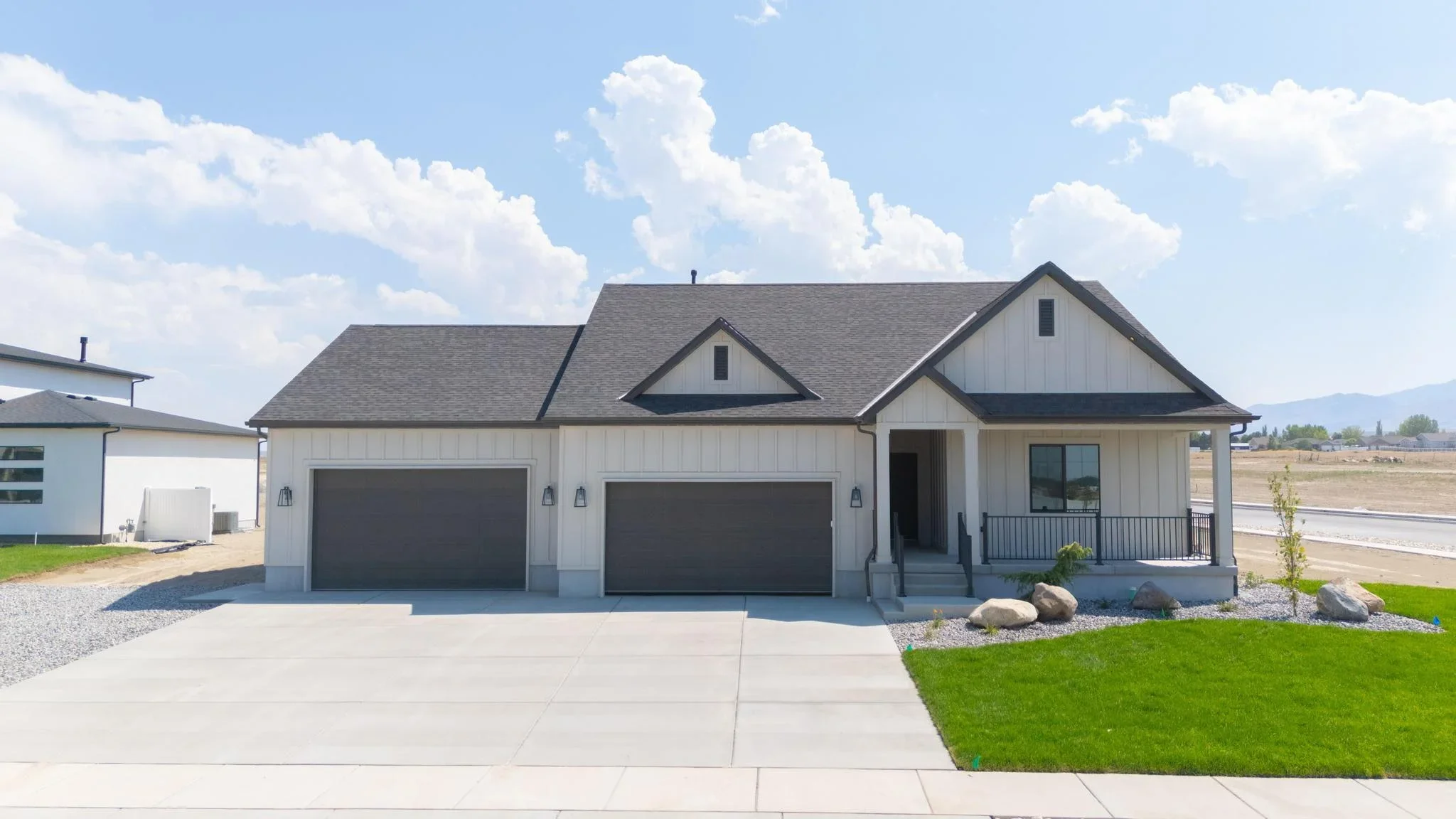 An Eagle Point Homes example showing the driveway, garage, lawn, and covered porch